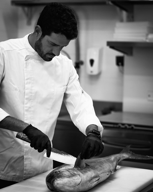 Chef Stefano Stracuzzi preparing the fresh catch